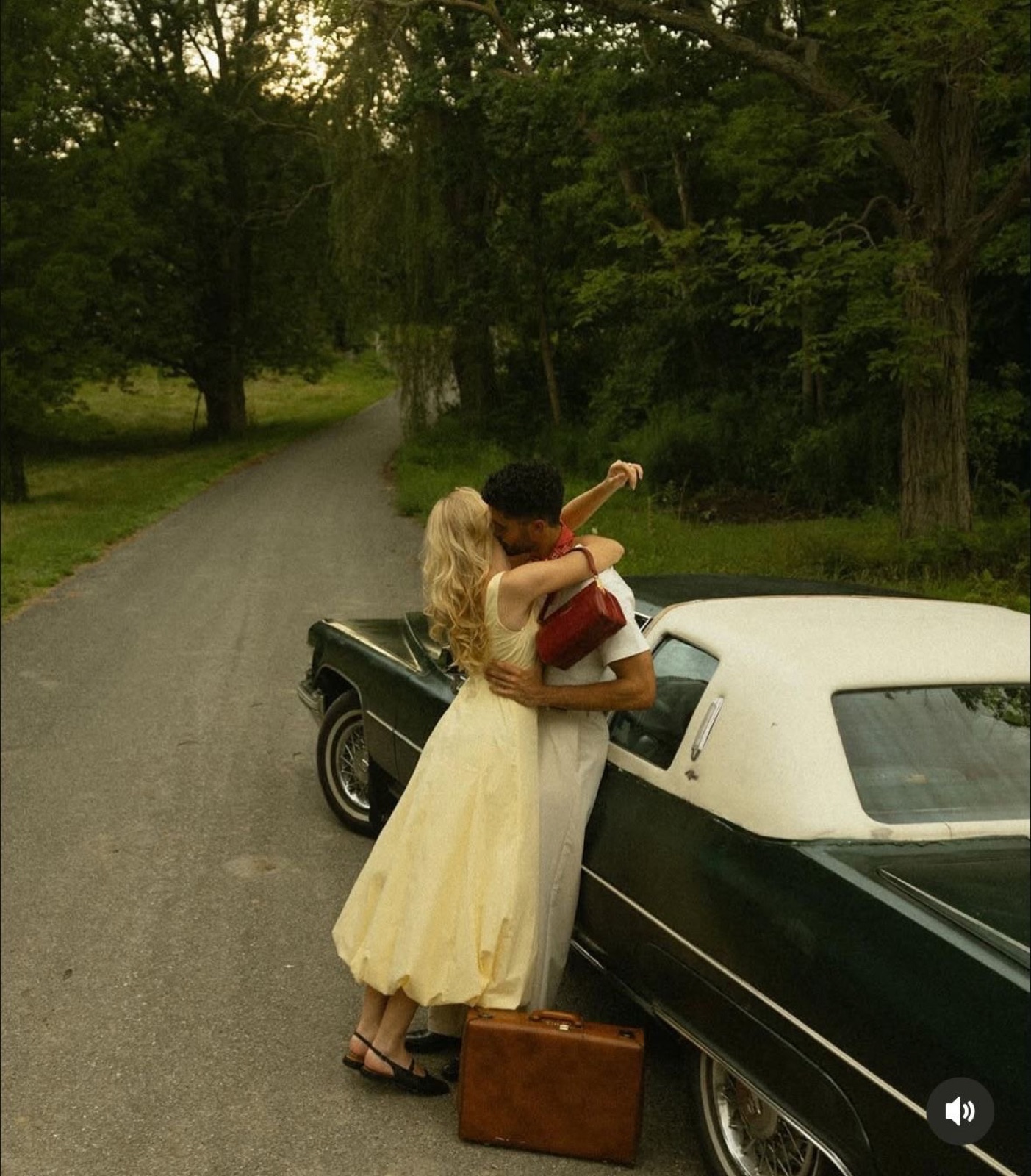 Couple with a vintage convertible