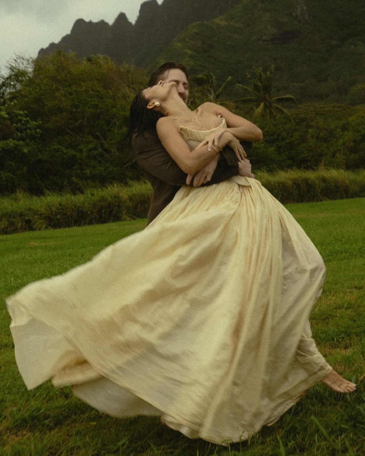 Dress swirling during a dance in front of mountains