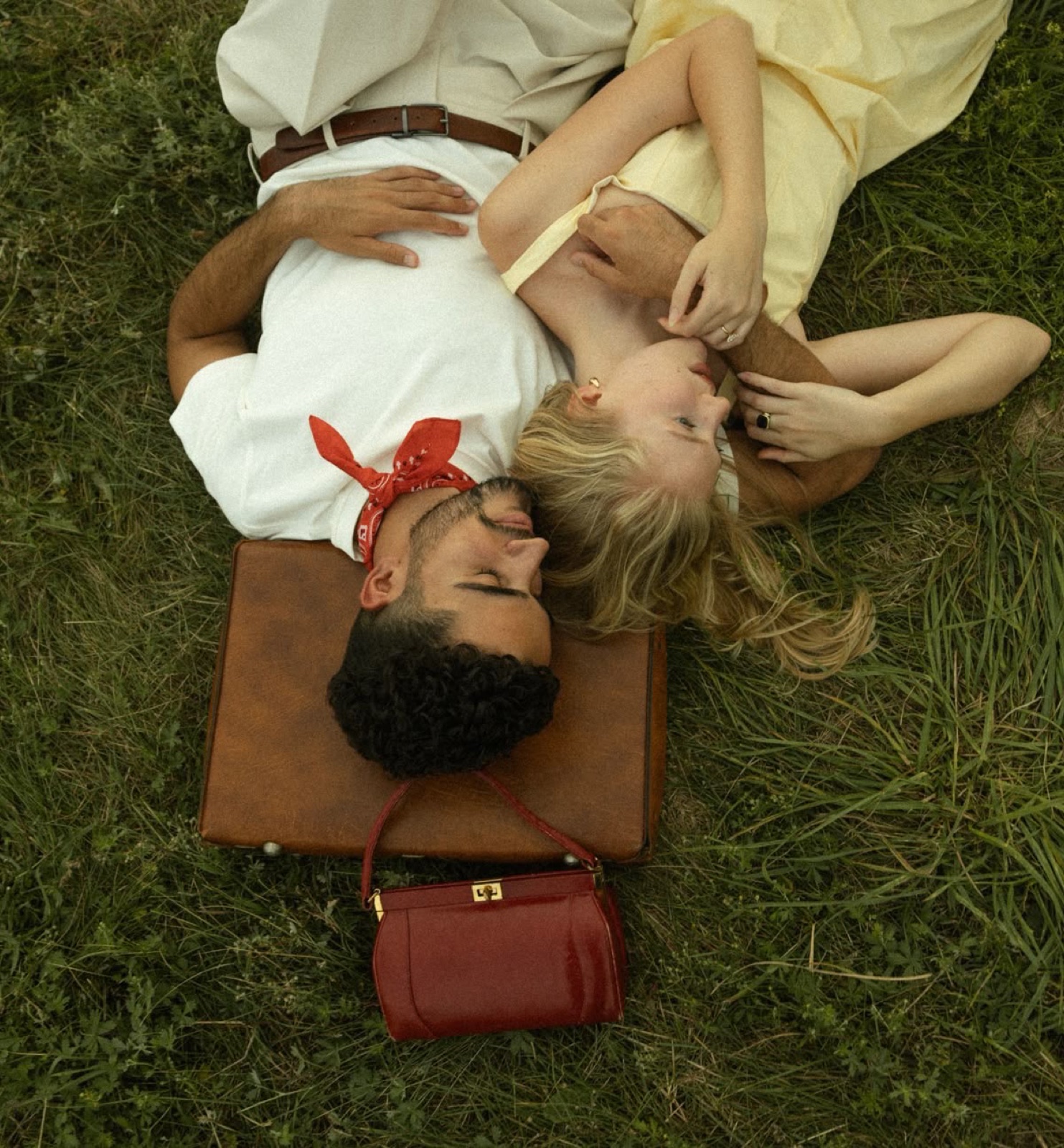 Family relaxing on the grass at a picnic