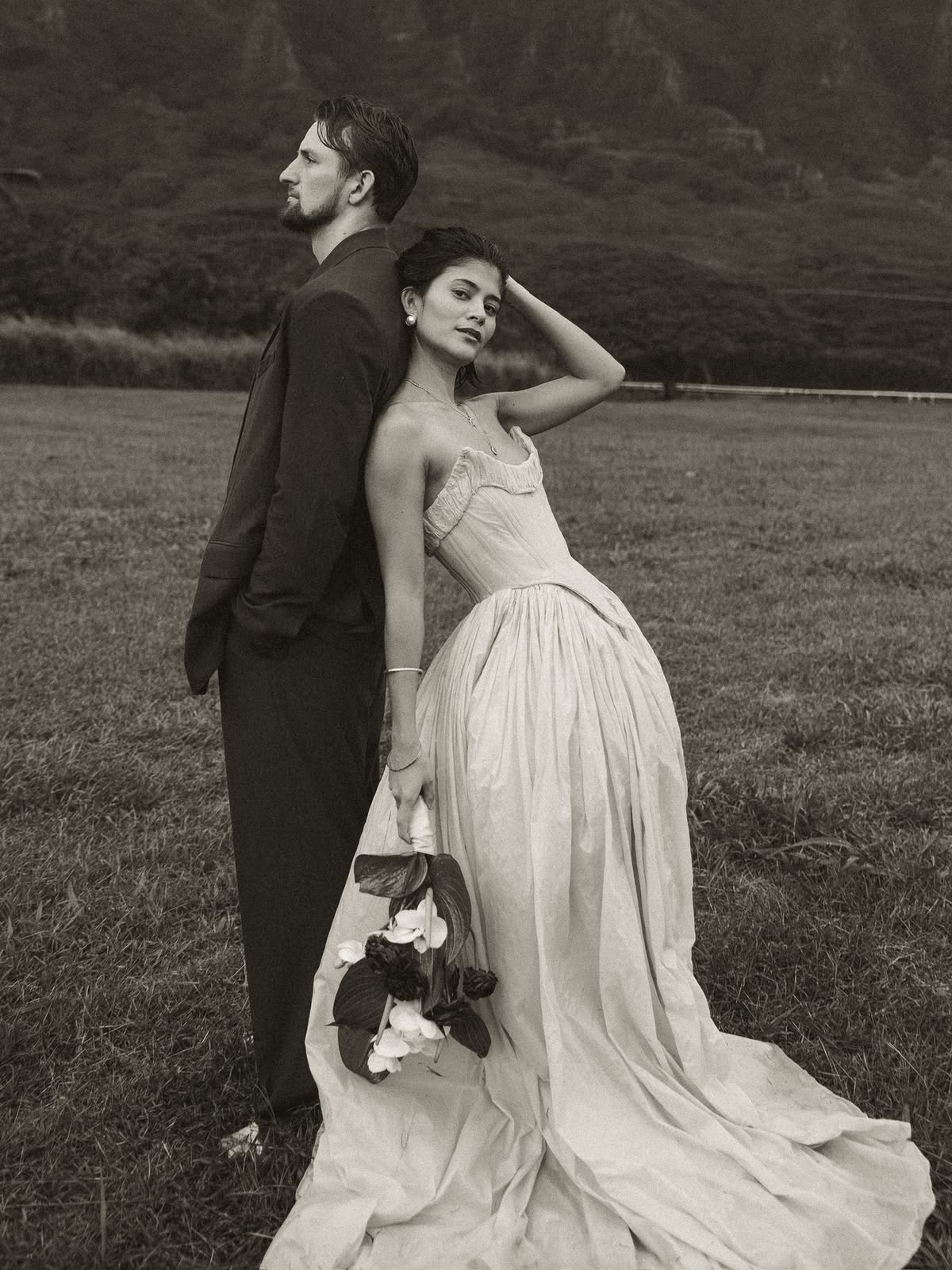 Bride and groom in black and white before mountains